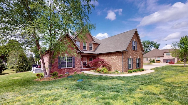 craftsman house featuring a front lawn and brick siding