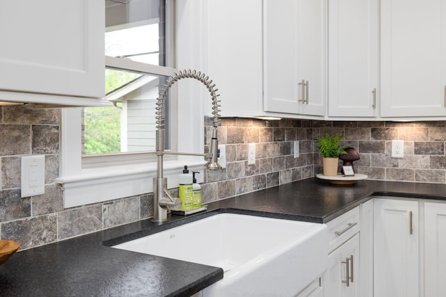 743 Fontwell Ln, Franklin, TN 37064 - kitchen with a sink, backsplash, white cabinets, and dark countertops