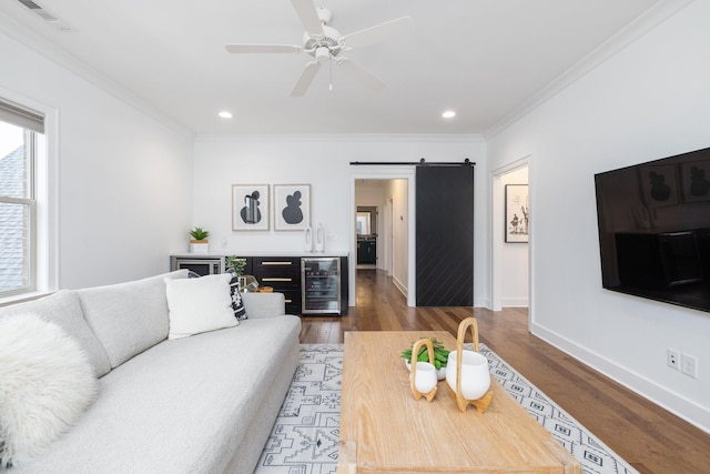 743 Fontwell Ln, Franklin, TN 37064 - living room featuring crown molding, baseboards, wood finished floors, wine cooler, and visible vents