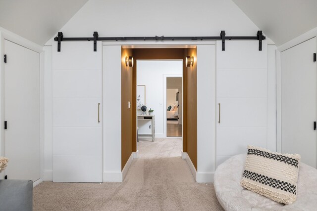 743 Fontwell Ln, Franklin, TN 37064 - hall featuring a barn door, lofted ceiling, and light carpet