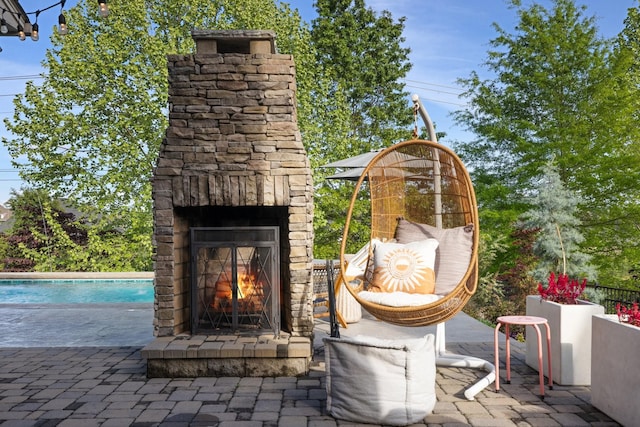 743 Fontwell Ln, Franklin, TN 37064 - view of patio / terrace with an outdoor stone fireplace and an outdoor pool