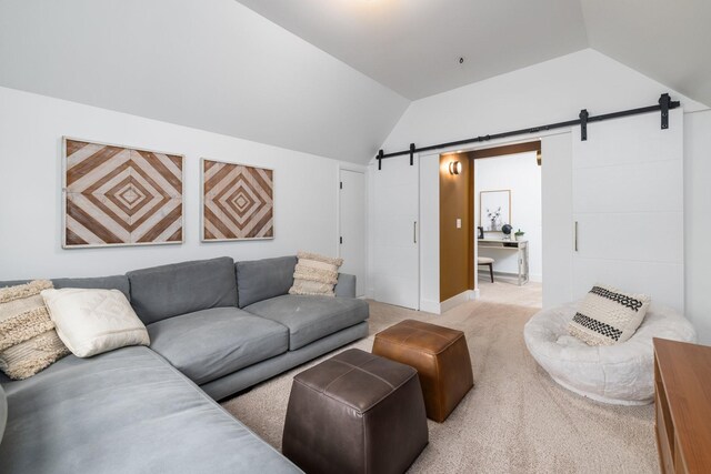 743 Fontwell Ln, Franklin, TN 37064 - living area featuring light colored carpet, a barn door, and lofted ceiling