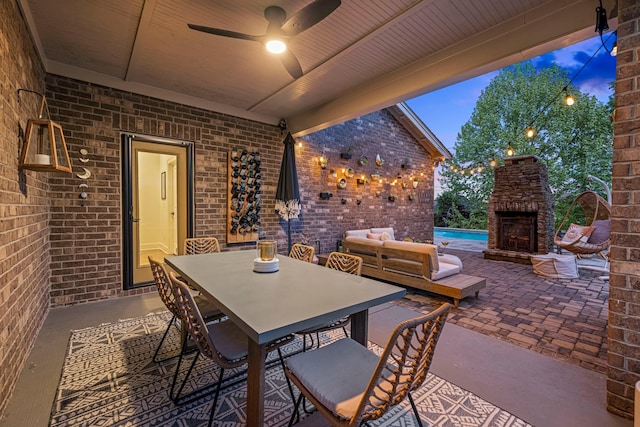 743 Fontwell Ln, Franklin, TN 37064 - view of patio featuring an outdoor stone fireplace, outdoor dining area, and a ceiling fan