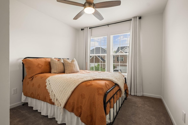 bedroom with baseboards, a ceiling fan, and carpet flooring