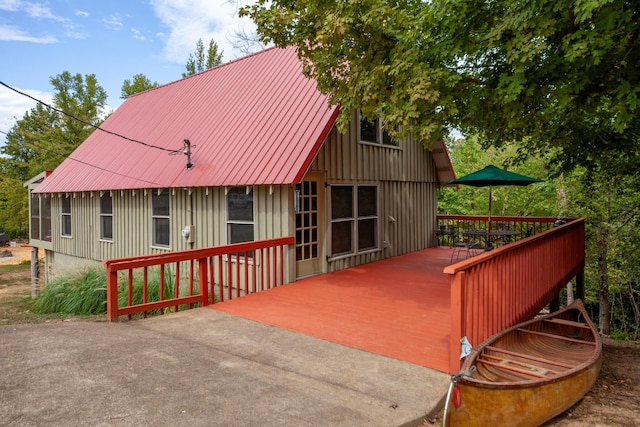 4428 Deer Creek Rd, Linden, TN 37096 - back of house with a wooden deck and metal roof