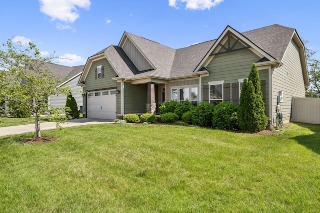 craftsman house with an attached garage, a front lawn, roof with shingles, and concrete driveway