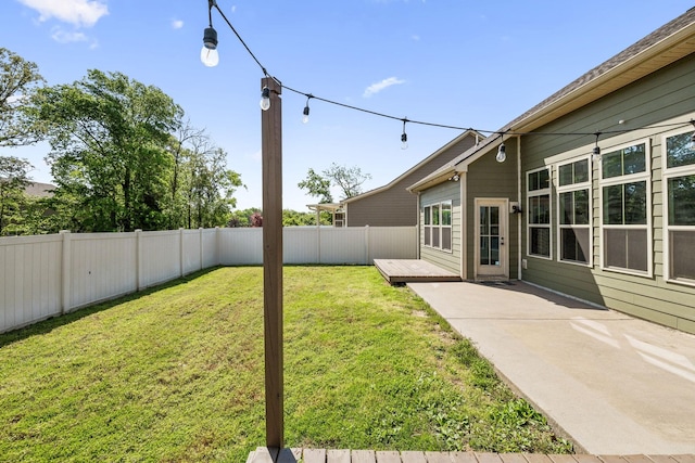 view of yard with a fenced backyard and a patio area