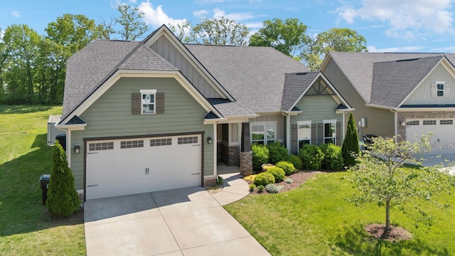 craftsman house featuring a garage, board and batten siding, a front yard, and concrete driveway