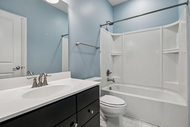 bathroom with vanity, washtub / shower combination, and toilet