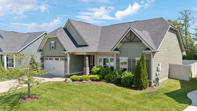 view of front of property featuring fence, an attached garage, concrete driveway, and a front lawn