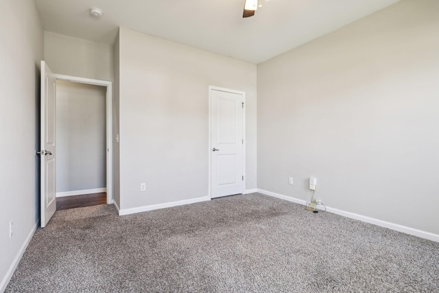 unfurnished bedroom with baseboards, carpet, and ceiling fan