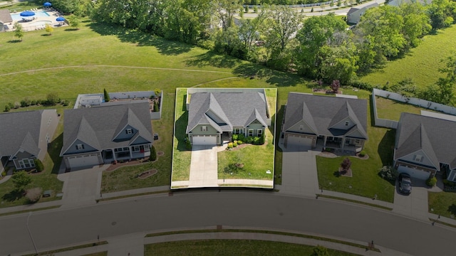 birds eye view of property with a residential view