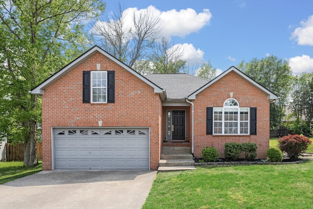 view of front of property with driveway, a garage, brick siding, fence, and a front lawn