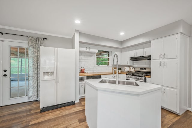 6505 Firestone Ct, Nashville, TN 37209 - kitchen featuring under cabinet range hood, white cabinets, a sink, gas stove, and white fridge with ice dispenser