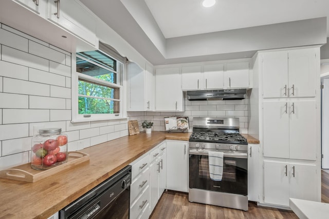 6505 Firestone Ct, Nashville, TN 37209 - kitchen featuring black dishwasher, stainless steel gas range, white cabinetry, under cabinet range hood, and tasteful backsplash