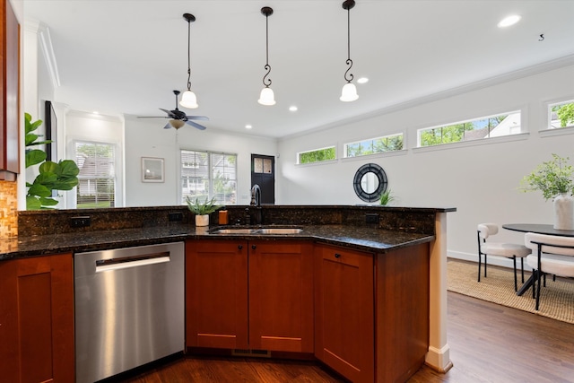 kitchen featuring ceiling fan, hanging light fixtures, a sink, stainless steel dishwasher, and ornamental molding
