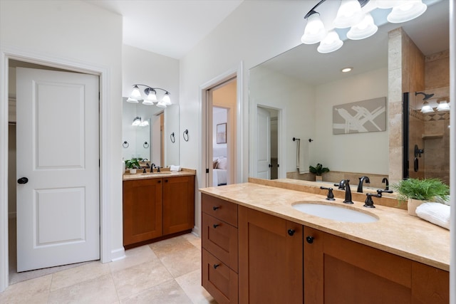 bathroom featuring tile patterned flooring, two vanities, a chandelier, a sink, and a tile shower