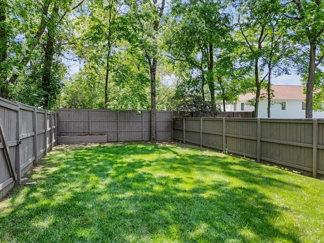 view of yard featuring a fenced backyard