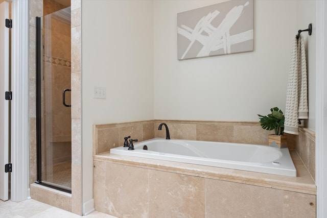 full bath with a shower stall and a garden tub