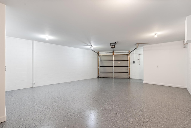 garage with concrete block wall