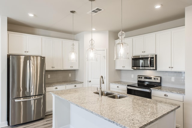 kitchen featuring a sink, white cabinetry, and stainless steel appliances