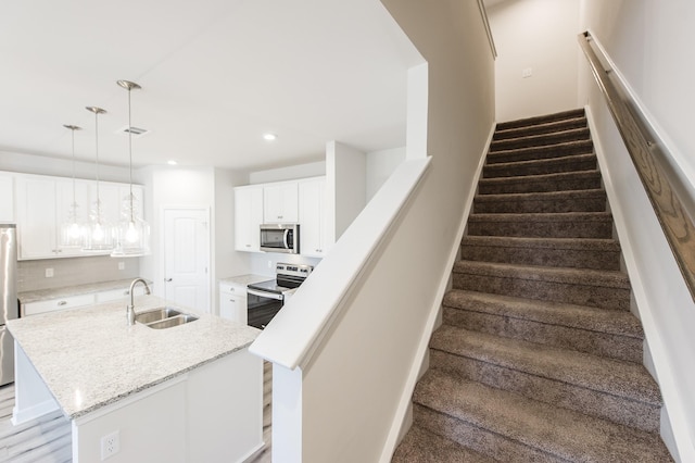 stairs featuring recessed lighting and visible vents
