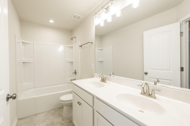 full bathroom featuring visible vents, a sink, bathing tub / shower combination, and toilet