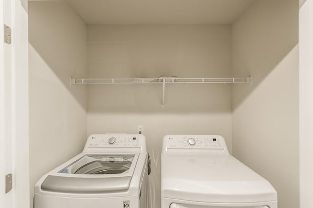 laundry area featuring laundry area and washing machine and dryer