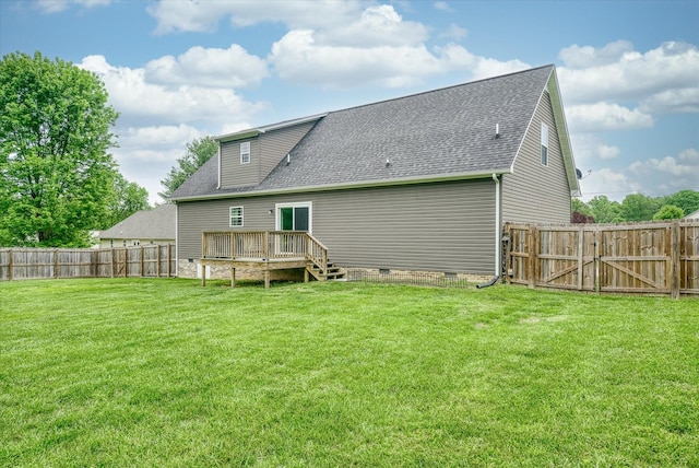 rear view of house with crawl space, a shingled roof, a fenced backyard, and a deck