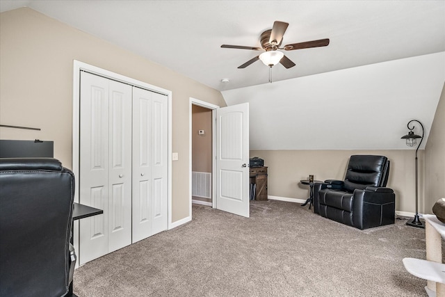 carpeted home office featuring baseboards, a ceiling fan, lofted ceiling, and visible vents