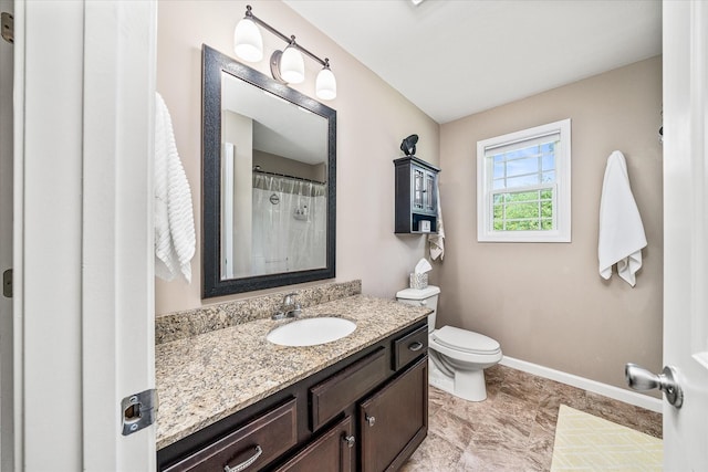 full bath featuring toilet, baseboards, and vanity