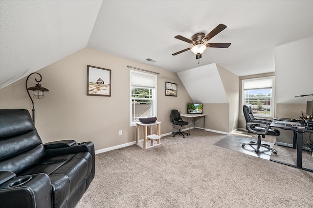 office featuring a ceiling fan, vaulted ceiling, and plenty of natural light