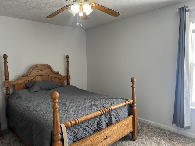 bedroom featuring carpet flooring, baseboards, and ceiling fan