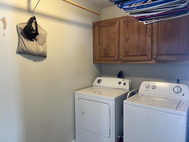 laundry room featuring cabinet space and independent washer and dryer