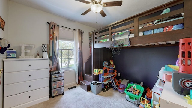 carpeted bedroom with ceiling fan and visible vents