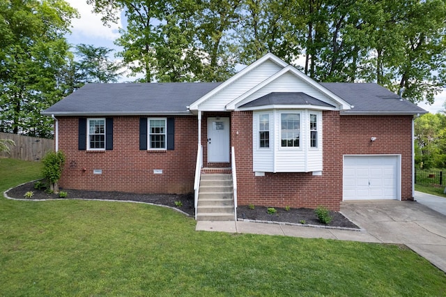 ranch-style home featuring fence, an attached garage, and brick siding