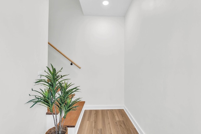 interior space featuring light wood-style floors, baseboards, and recessed lighting