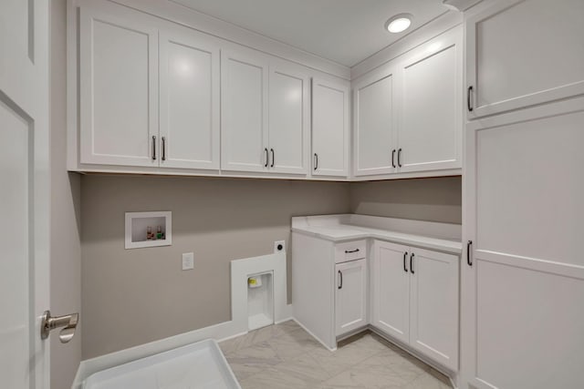 washroom with electric dryer hookup, cabinet space, baseboards, hookup for a washing machine, and marble finish floor