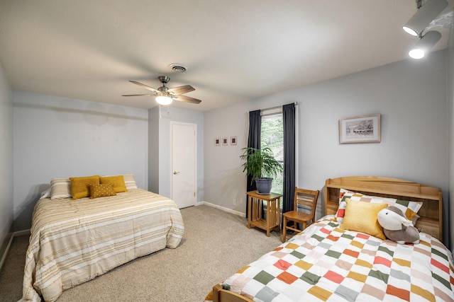bedroom featuring ceiling fan, light carpet, and baseboards