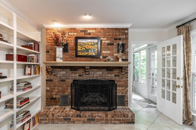 living area featuring crown molding, tile patterned floors, a brick fireplace, and visible vents