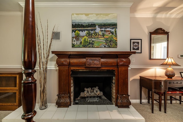 sitting room with crown molding, carpet flooring, visible vents, and a fireplace
