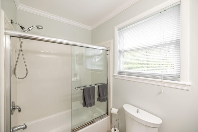full bath with crown molding, bath / shower combo with glass door, and toilet