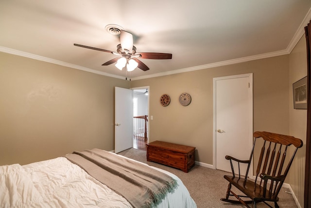 bedroom with crown molding, carpet floors, ceiling fan, and baseboards