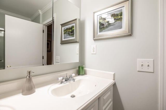 bathroom with crown molding and vanity