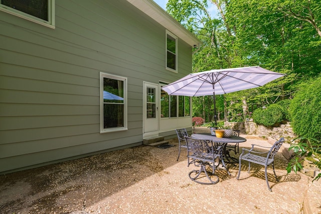 view of patio / terrace with outdoor dining space and entry steps
