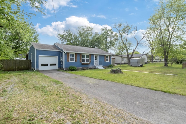 ranch-style house featuring aphalt driveway, fence, a front yard, and a garage