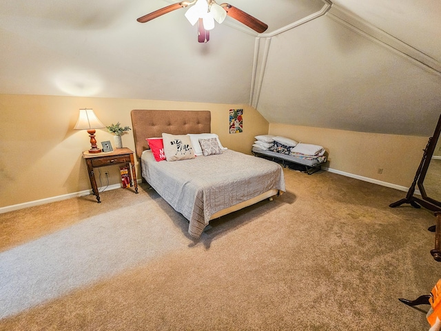 bedroom with carpet floors, baseboards, and lofted ceiling