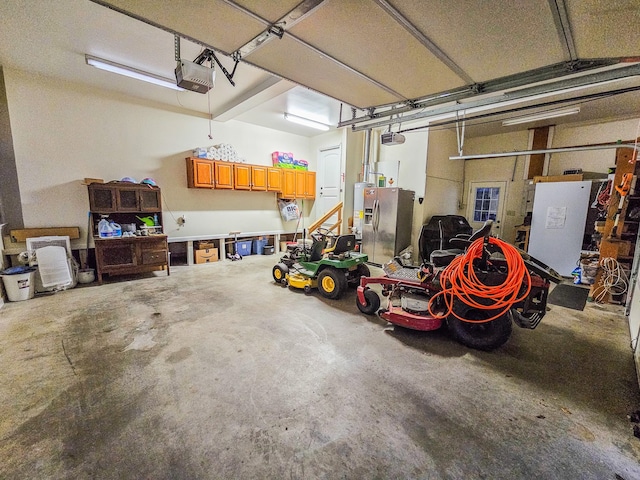 garage with a garage door opener and stainless steel fridge with ice dispenser