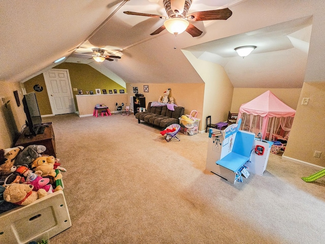 rec room featuring ceiling fan, vaulted ceiling, and carpet