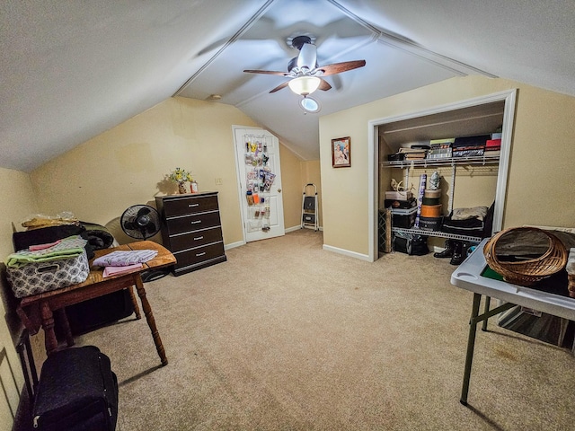 living area with carpet flooring, ceiling fan, and lofted ceiling
